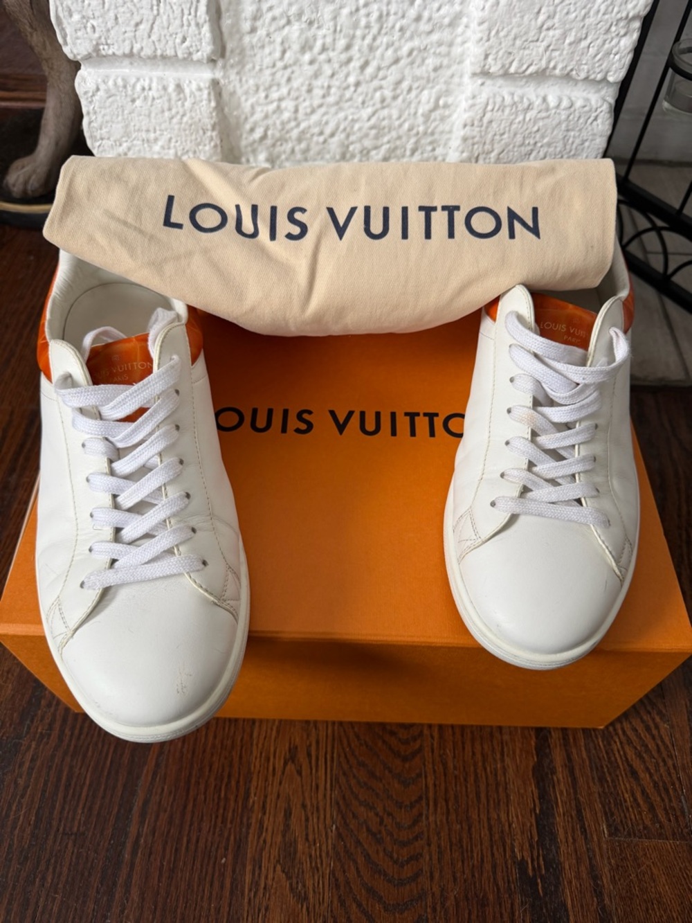 Louis Vuitton Mens Luxembourg Sneaker. Size 8. White/orange trim.Gently worn.